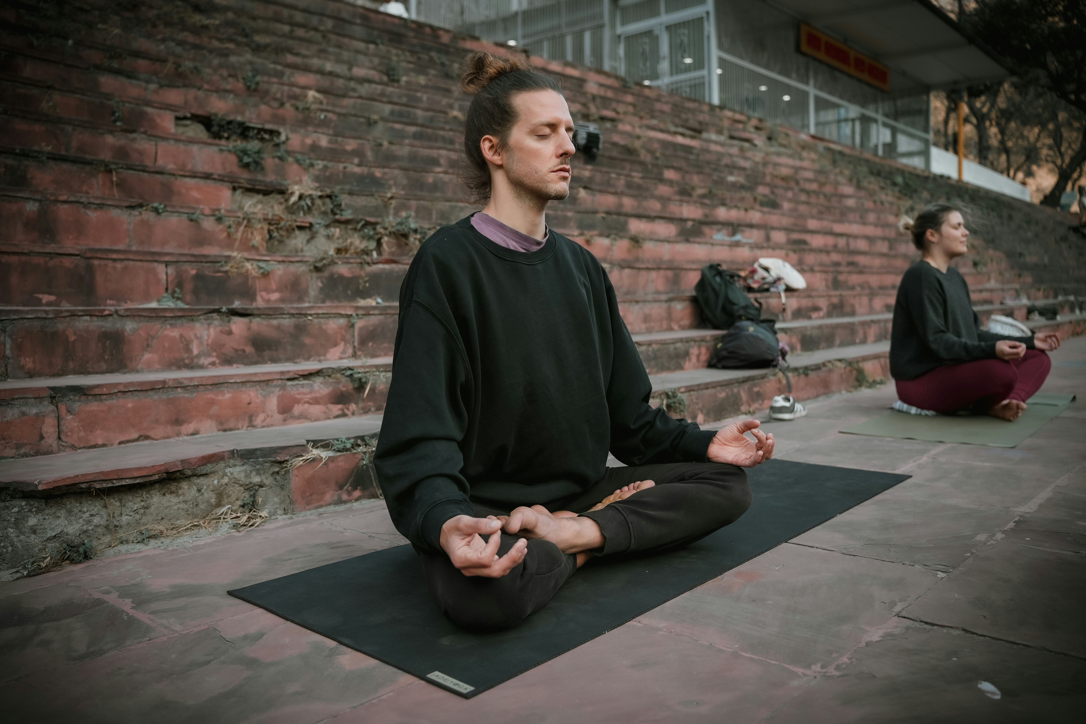 A person practicing meditation to manage stress