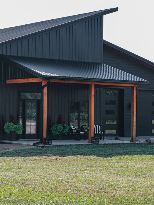 Black pole barn house
