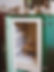 Image of the inside of an empty kiln with objects to be fired resting on top of it 