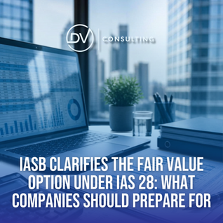 Finance professionals reviewing investment valuations and accounting reports following the IASB’s clarification of the fair value option under IAS 28.
