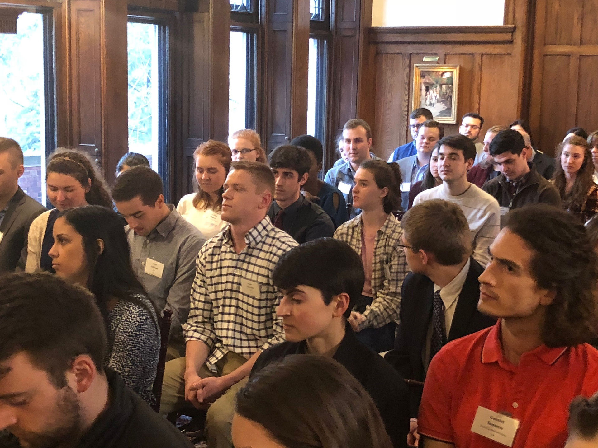 Students fill the room at the 'Cuse House