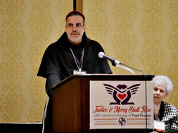 Bishop John Stowe leads prayer at LGBT Catholic gathering