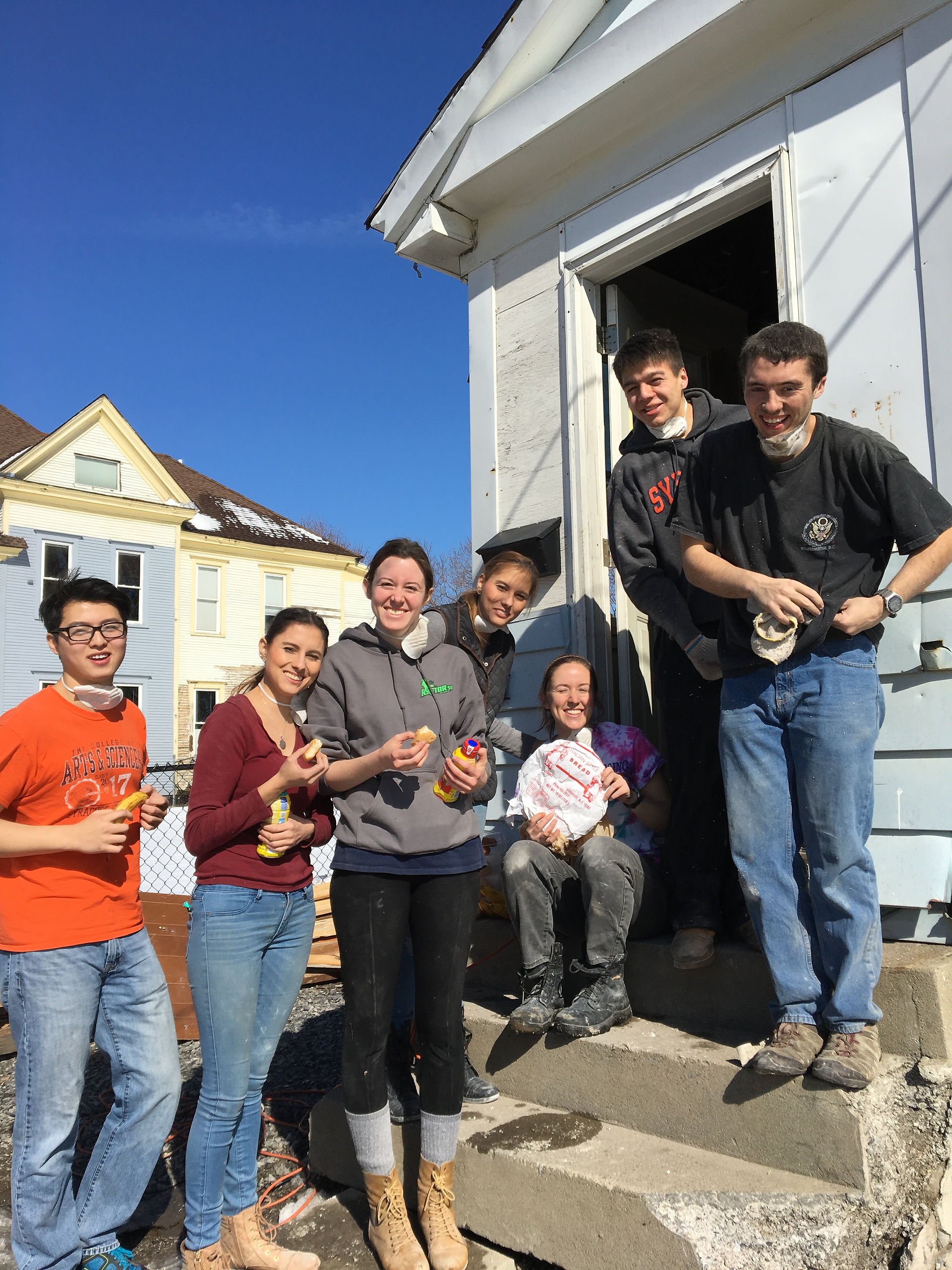 Students prepare to help build a home.