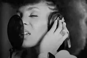 Black and White Photo of Ashlie Amber singing in the Studio