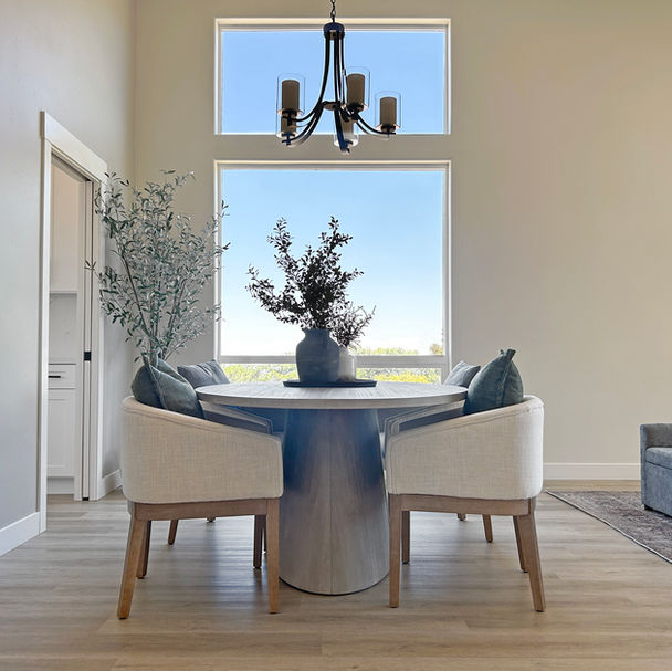 man walking through modern white kitchen