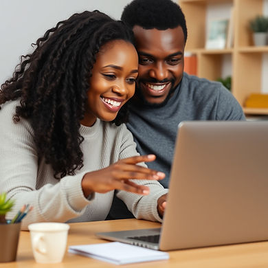 African American couple studying a computer together, their faces are smiling_edited.jpg