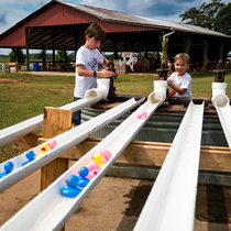 kids racing rubber ducks