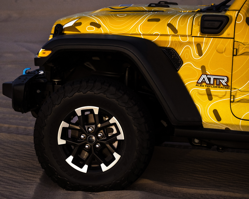 a yellow jeep with the word att on the side