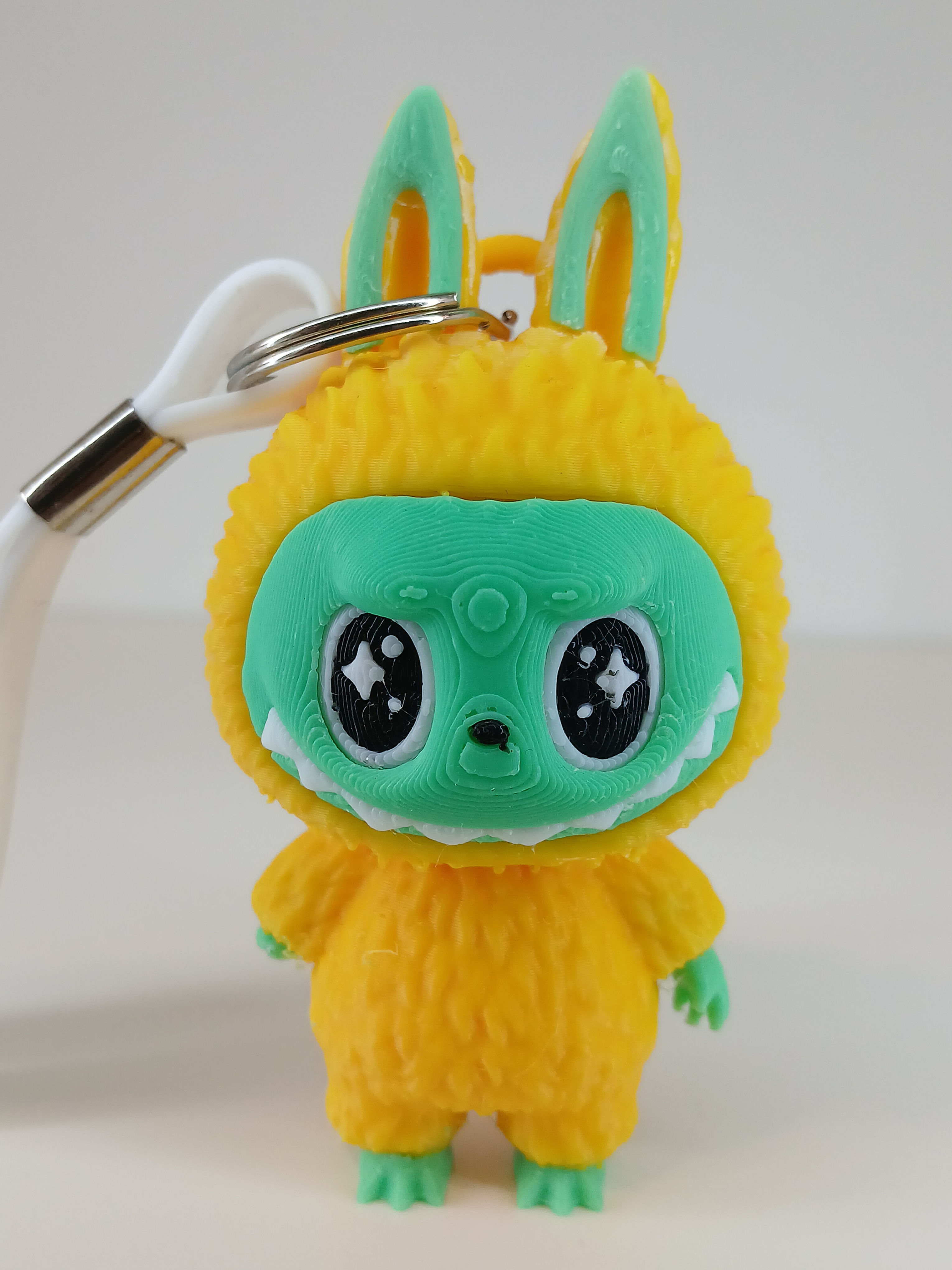 Porte-clé style Labubu avec une seule main 40x50 mm