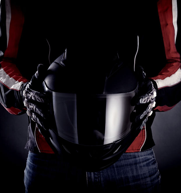 Hands-of-Motorcycle-Rider-Holding-Helmet