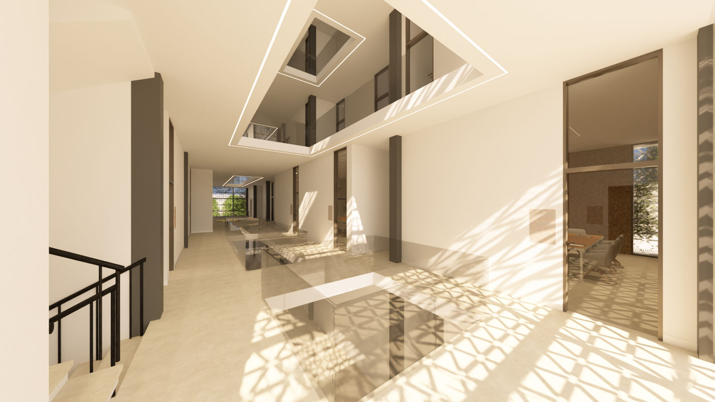 Galería interior con lucernario lineal y sombras de celosía diseñada por Genovés Calleja Arquitectos.