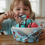 Thumbnail: Young child happily eating large ice cream sundae in a Mario Bowl Cozy.