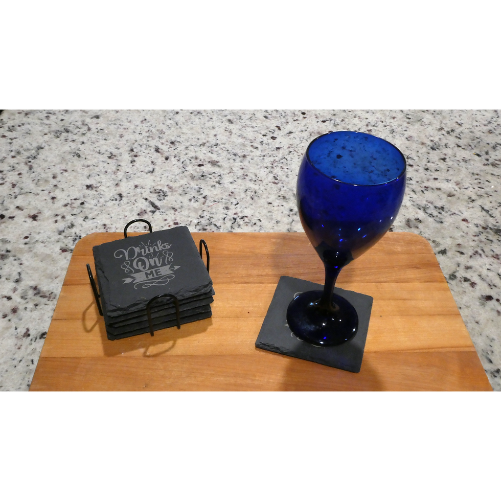 "Friends & Wine" slate coasters and blue wine glass on wooden board.