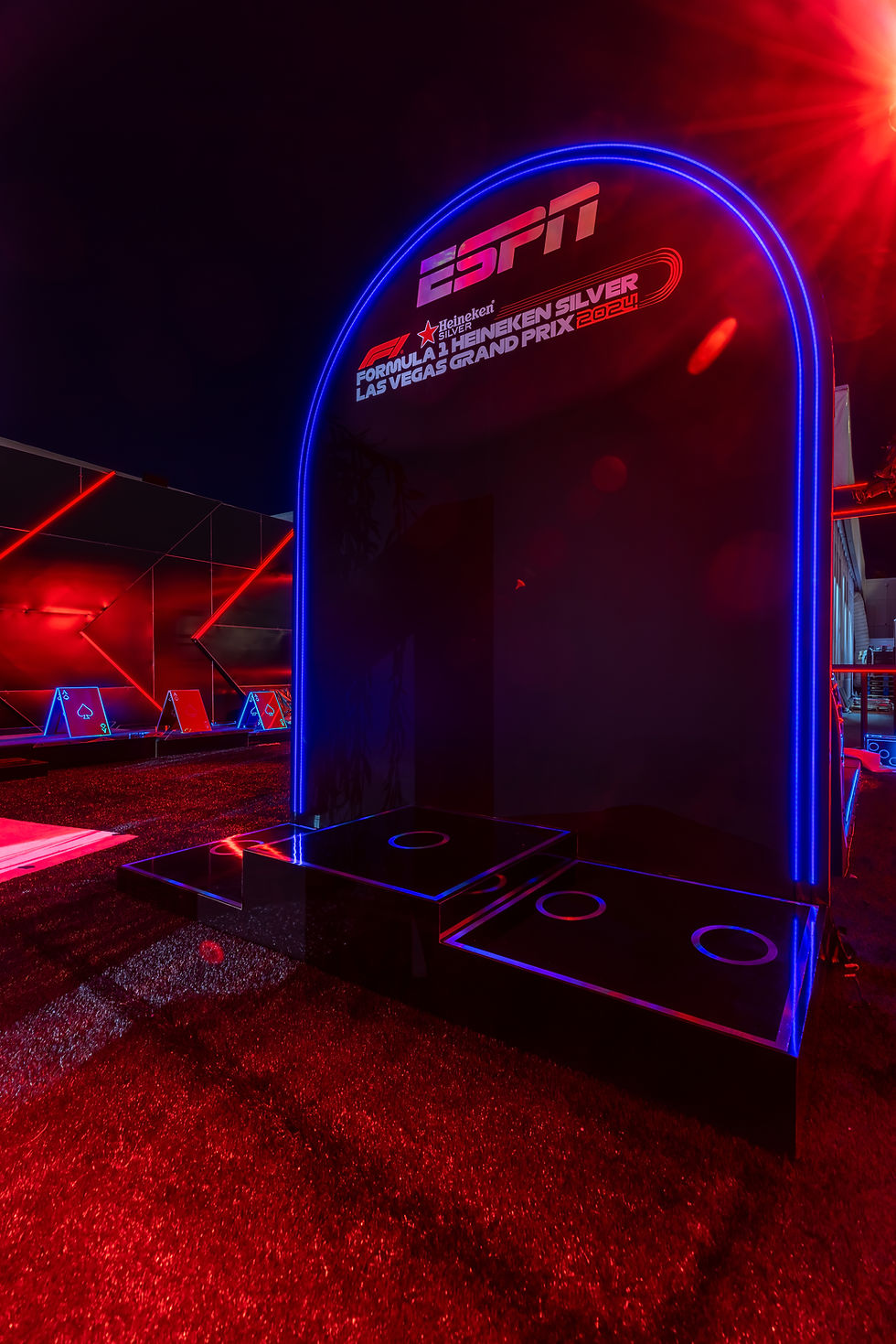 Neon-lit event space with ESPN sign for Formula 1 Heineken Silver Las Vegas Grand Prix 2024. Red and blue lights create a vibrant ambiance.