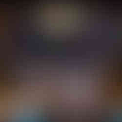 A luxurious DJ booth with a marble countertop, framed by a floral-patterned wall and gold accents, featuring Papi Steak and Fontainebleau Las Vegas branding.