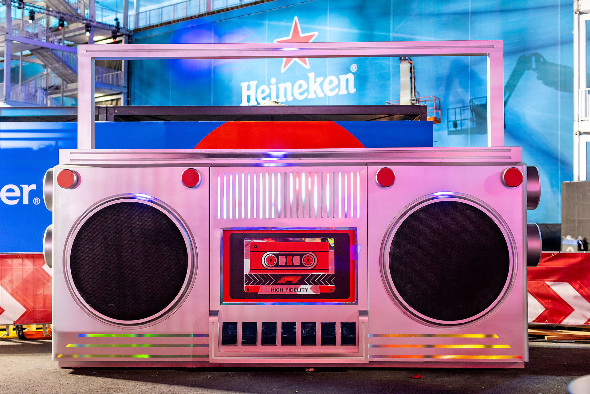 A large, colorful boombox sculpture at F1 with a retro cassette design.