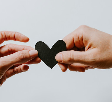 man and woman holding a heart together_edited.jpg