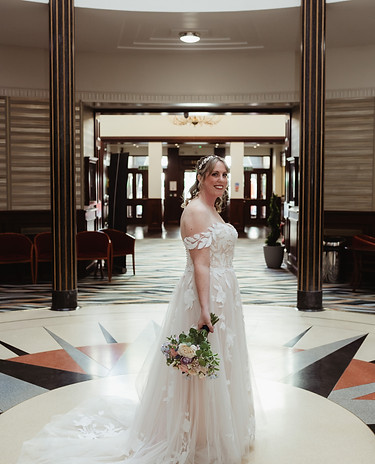 Bride Shelley in image of hotel lobby just before wedding.