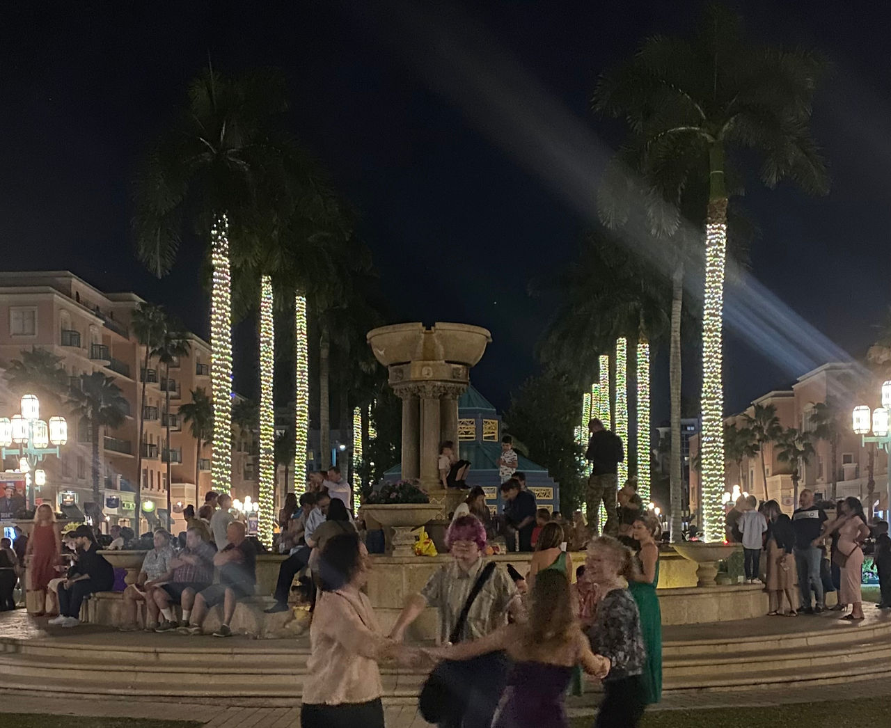Lively Mizner Park at Night with celebrations 