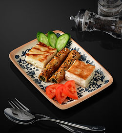 Spinach rolled borek, potato rolled borek, su borek with Maras cheese and home-made su borek with feta cheese, served with tomatoes cucumbers.