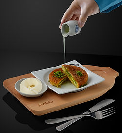 Served with one layer of plain ice cream and powder pistachio on the side.