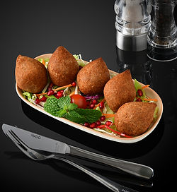 A mixture of cracked wheats, stuffed with minced meat, pine nuts and onion.