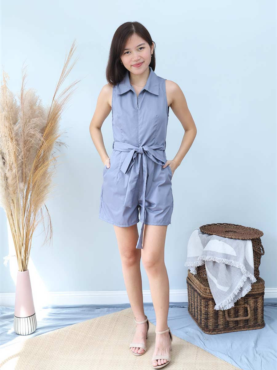 Thumbnail: a model wearing an effortlessly chic sleeveless front zip romper