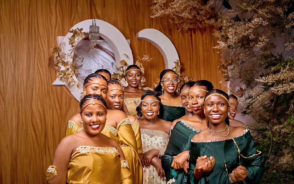 Group of smiling women in traditional gold and green attire