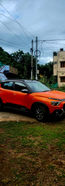 Orange and black modern car self drive car rentals in vizag