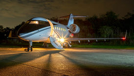 super midsize jet cabin displaying spacious seating arrangements and luxurious amenities. The cabin accommodates approximately 8 to 10 passengers, providing ample room for comfortable travel during long-range flights. The modern, stylish design includes high-end finishes and furnishings, ensuring a luxurious and enjoyable flying experience.