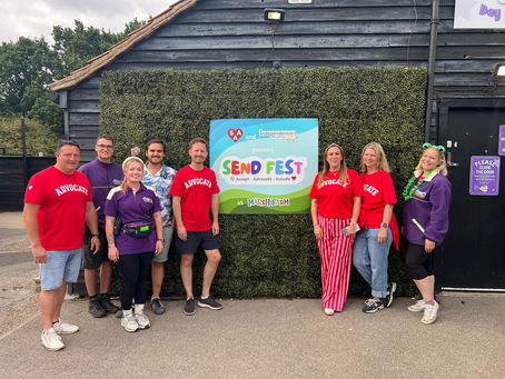 A group of organisers, by a SEND Fest sign.