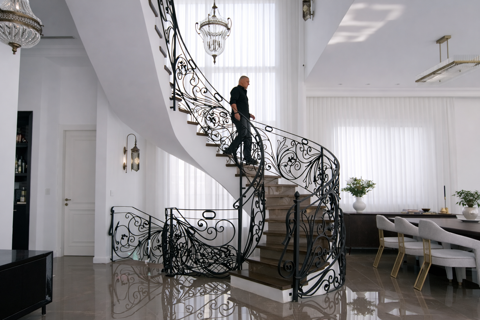 Luxury spiral staircase with decorative railing inside Abu Dhabi villa UAE