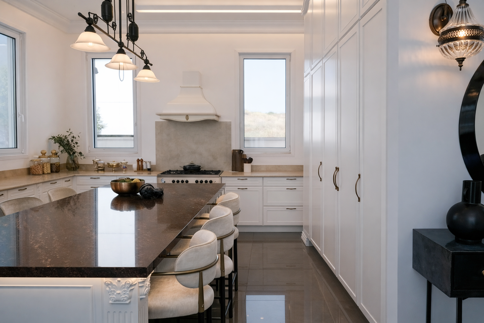 Luxury villa kitchen with large island and bar seating in Abu Dhabi UAE