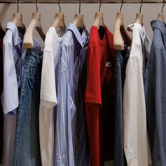 Colourful Jacquemus garments displayed on a clothing rail inside the Dubai boutique.