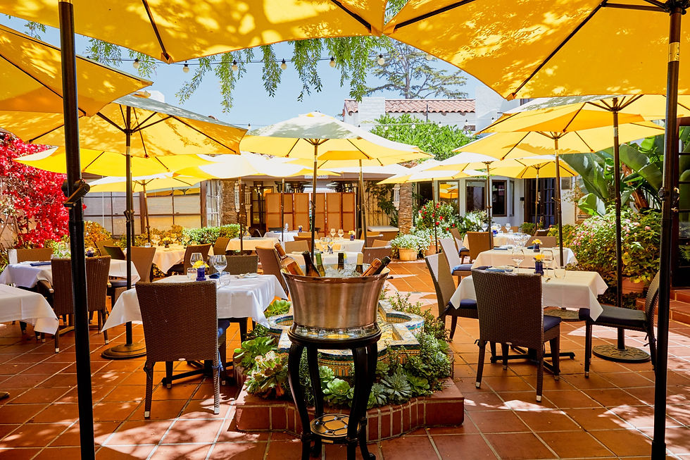Mille Fleurs outdoor patio with yellow umbrellas