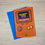 Thumbnail: Red Dad retro gamer birthday card displayed with  blue kraft envelope.