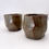 Thumbnail: Faceted cup in dark wood ash glaze