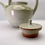 Thumbnail: Stoneware teapot in soft white with sprays of copper oribe and wood ash
