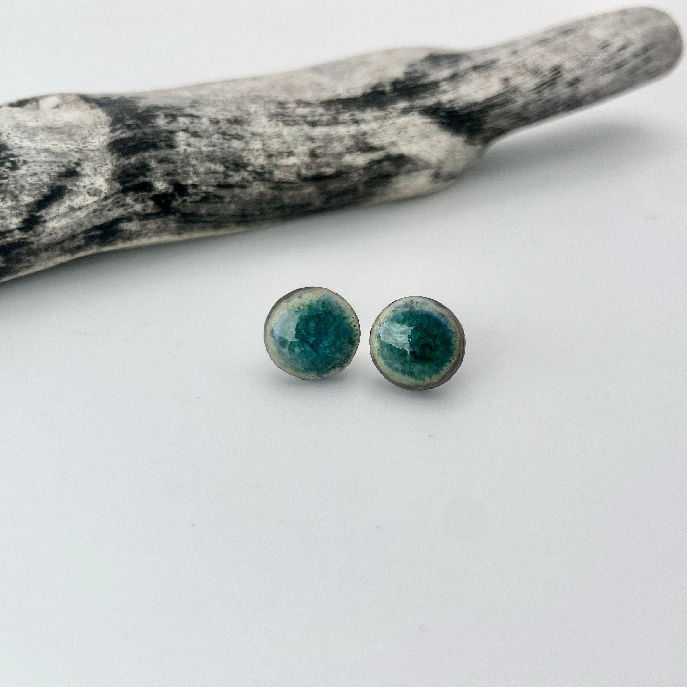 Black porcelain studs in green