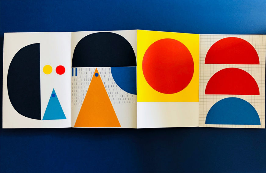 Detail of a concertina book featuring Laura Obon's colourful geometric collages on a blue surface.