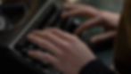 a person typing on a keyboard