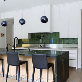 Modern white oak and white laminate kitchen with stainless steel countertops Toronto