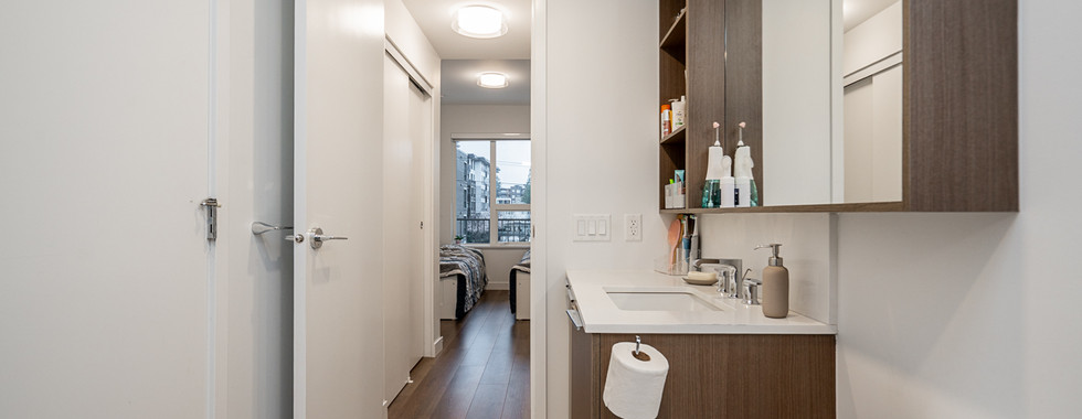 Modern bathroom finishes in luxury Port & Mill condo unit.