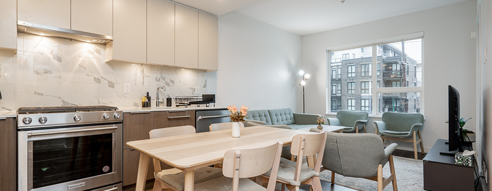 Luxury kitchen with high-end appliances in Burquitlam condo listing.