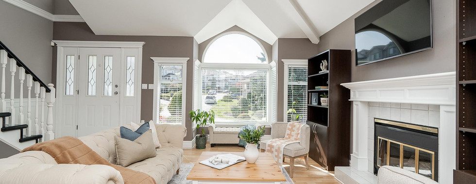 Spacious living room with vaulted ceilings and gas fireplace at 2653 Klassen Court Coquitlam.
