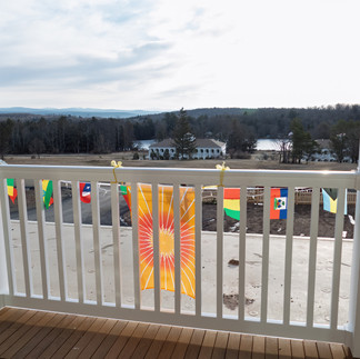 Balcony view with decorative flags.