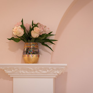Architectural details—arch and column with bouquet of flowers