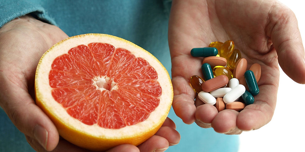 Holding grapefruit and vitamins