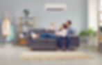 Young family couple enjoying life in their apartment with a modern air conditioning system