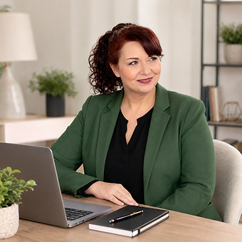 Nicole Sitting at a modern desk.png